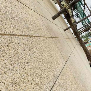 呼伦贝尔 黄金麻花岗岩荔枝面外墙干挂石材效果示例